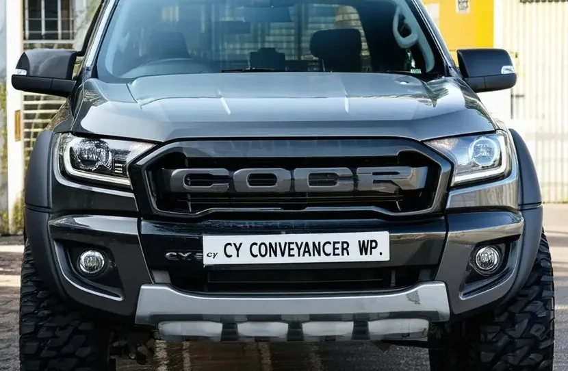 Car with number plate CY CONVEYANCER WP; alluding to it being owned by a conveyancing attorney based in Bellville